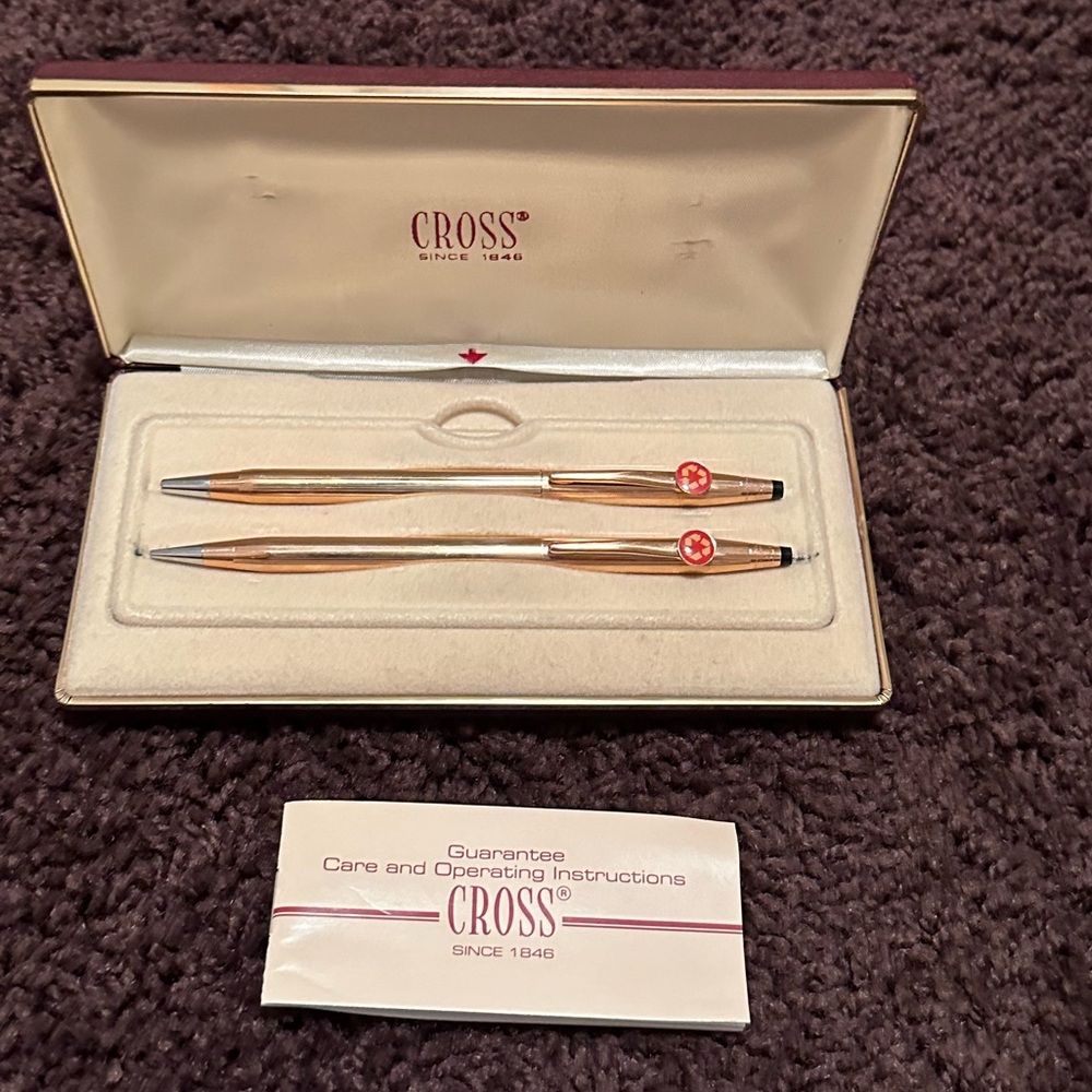 Vintage cross pen and pencil set with the recycler logo in red.  Gold
